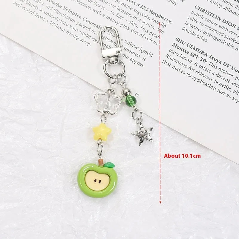 Fruit mobile phone charm keychain with apple, strawberry designs on plastic/resin with rope attachment