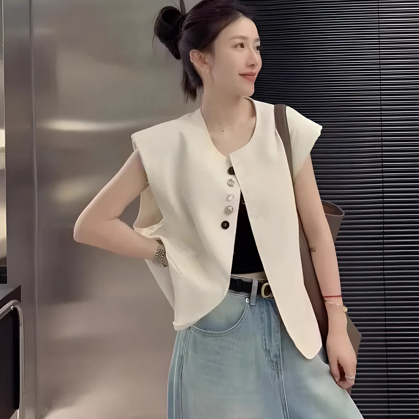 Women's loose fit polyester vest in milky white, showing front view with pockets.
