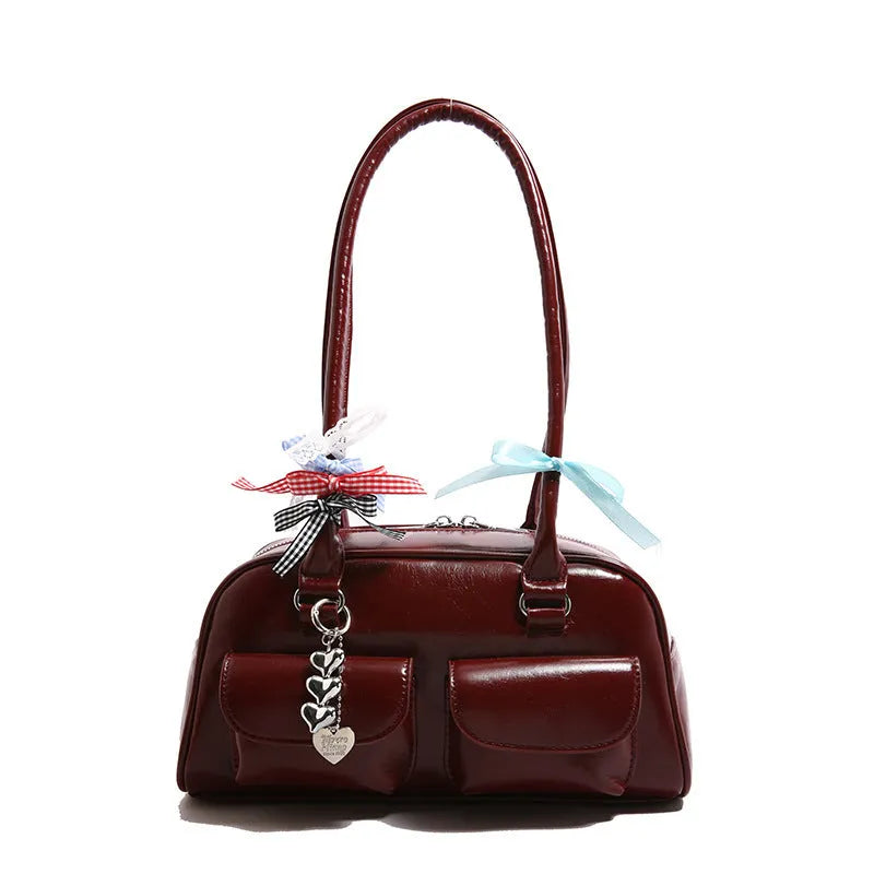 Women's black PU leather retro pillow handbag with double shoulder strap and flap closure.