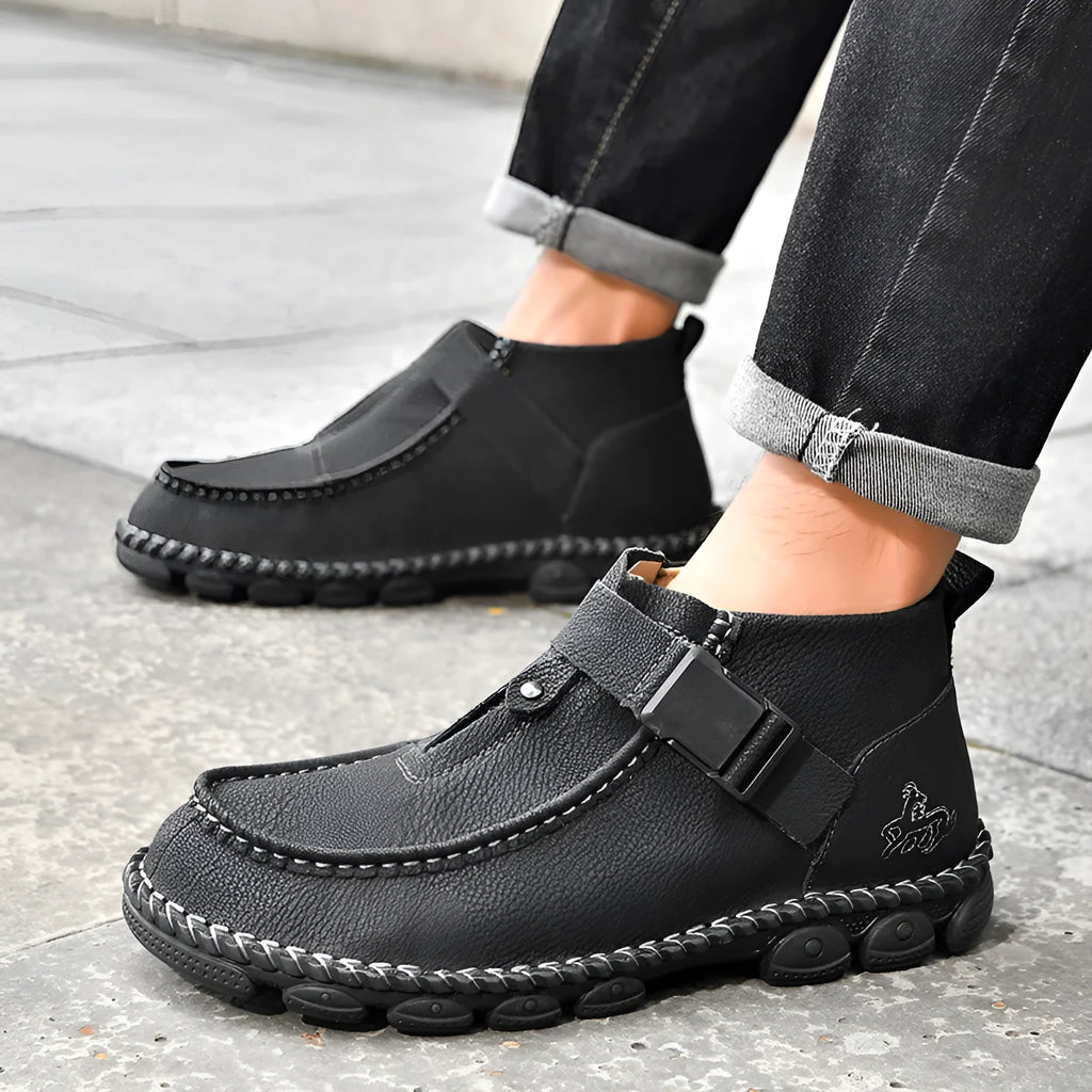 Casual flat heel slip-on shoe in synthetic leather with handmade stitching on the sole.