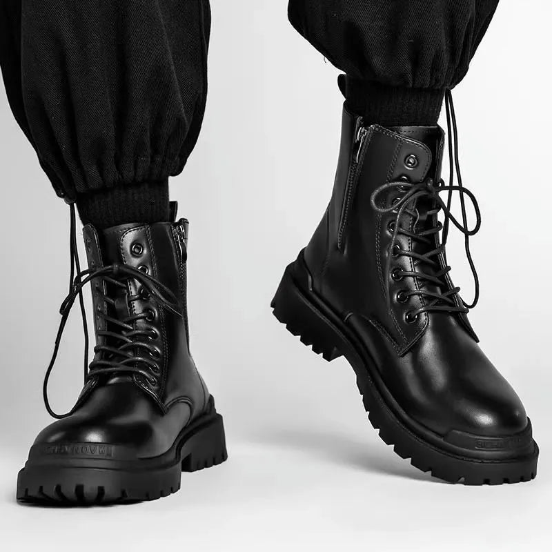 Men's black and brown mid-top leather boots with flat rubber soles.