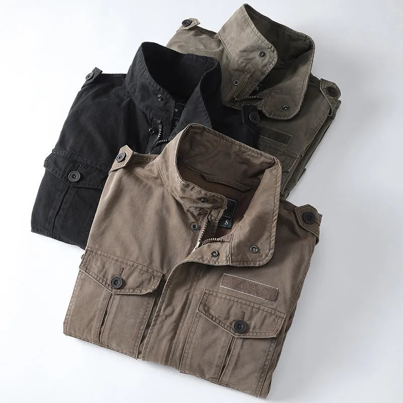 Man wearing a loose-fit light brown cotton twill zip-up jacket with a retro style.