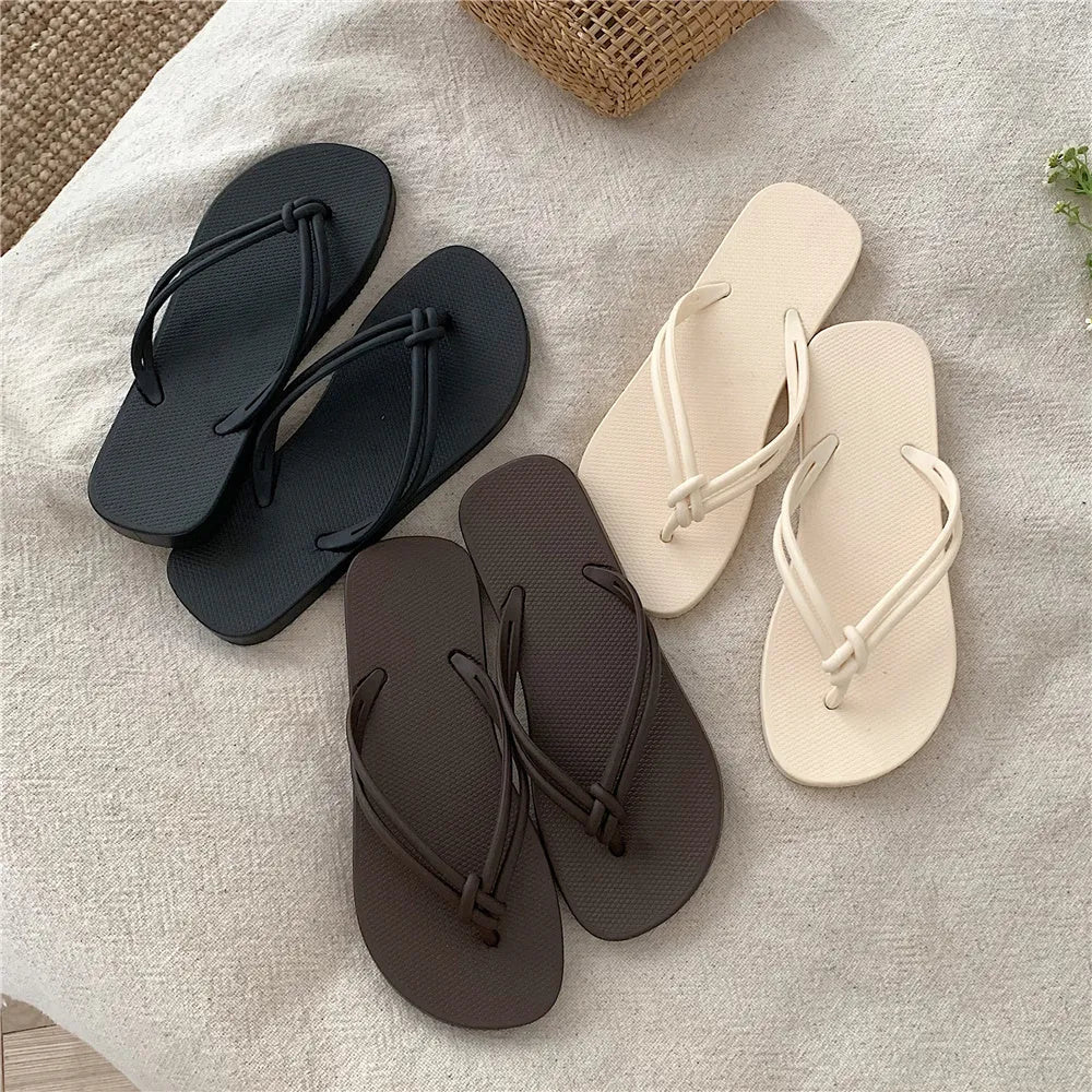 PVC toe-covering flip flops for men on a plain background showing colours and injection-moulded sole.