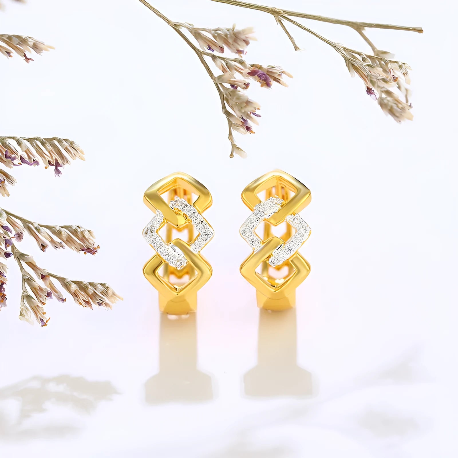 Geometric hollow-out gold earrings with colour separation style and electroplated alloy construction