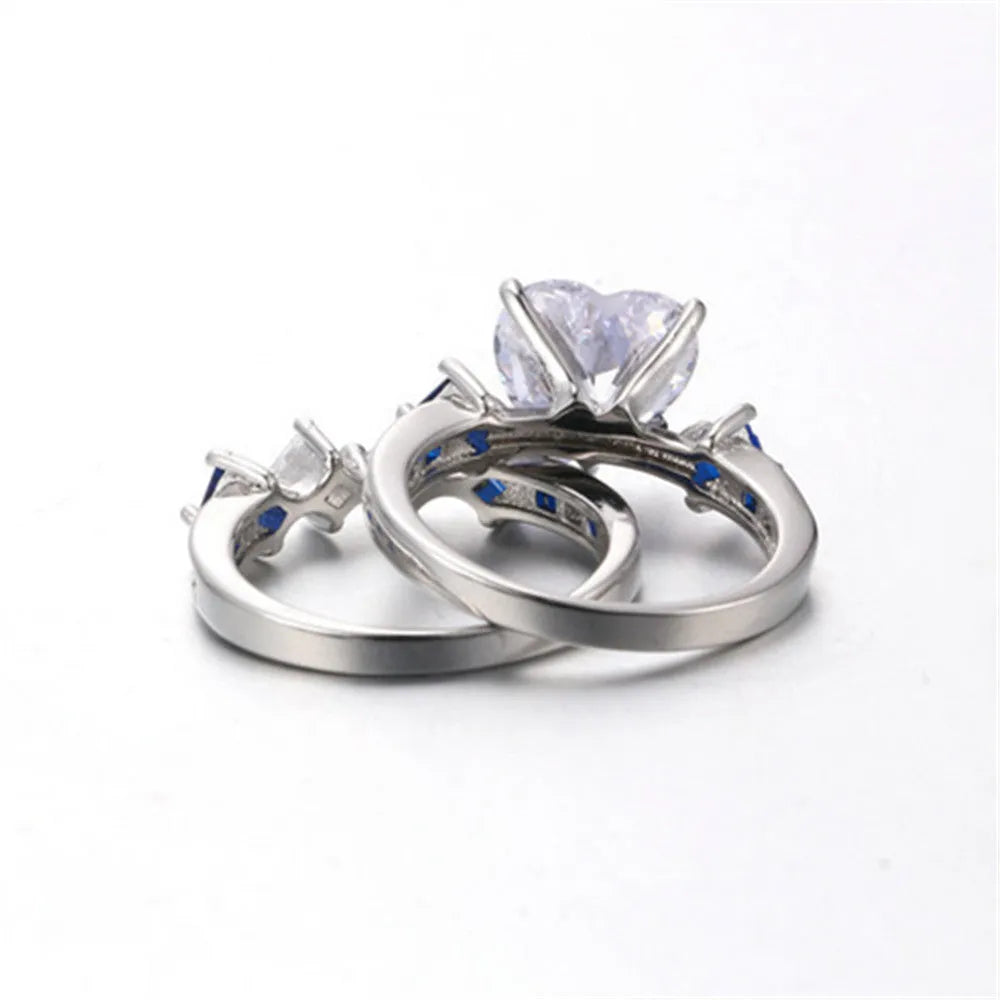 Silver-tone alloy heart-shaped geometric ring set on hand showing silver finish and multiple rings