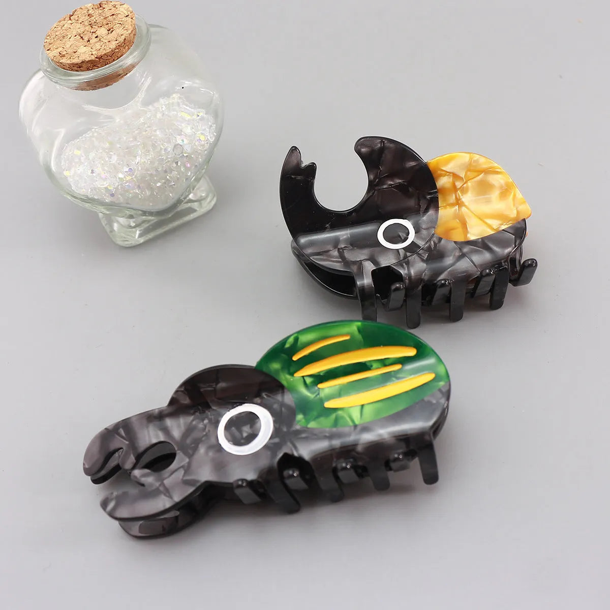 Handmade acetate beetle grip sheet with insect biology design for specimen display