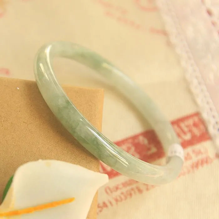 Green jade waxy geometric bead bracelet with 10mm beads and adjustable sizing options