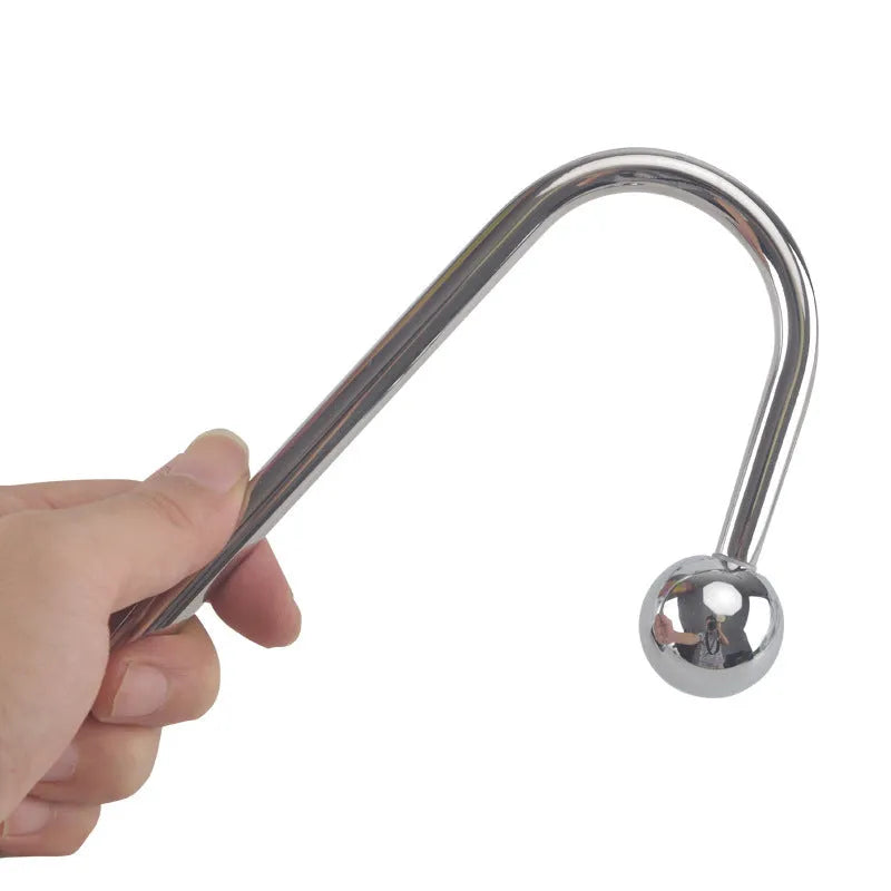 Silver metal stainless steel electric shock couple toy with three round bead sizes on a dark surface