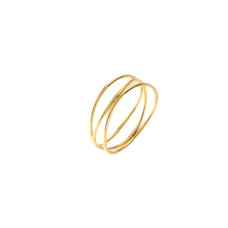 Gold titanium steel women's ring with a three-layer geometric line and coiled design on a white background.