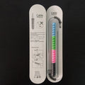 Two plastic cable protectors, 3.5cm long, in assorted colours next to a charging cable.