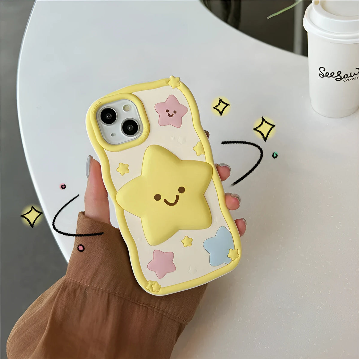 Yellow silicone phone case with smiley face design compatible with iPhone 12 to 15 series