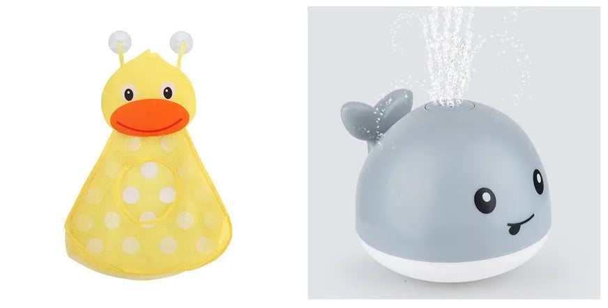 Automatic electric whale bath toy spraying water with LED lights on, floating in a baby bath.