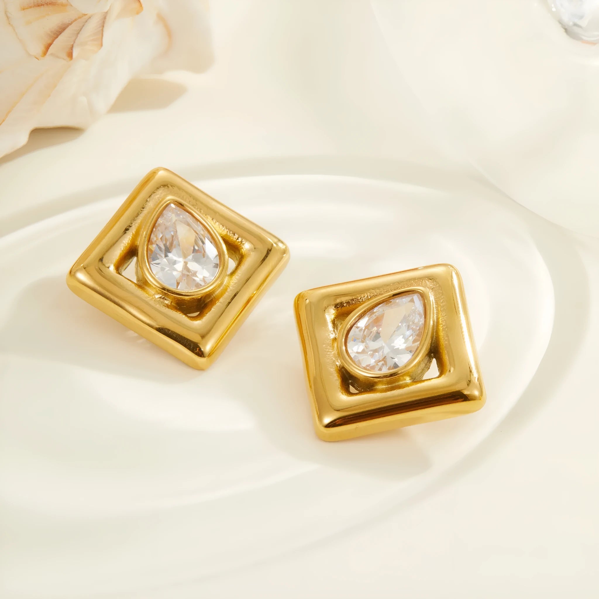 Gold geometric stud earrings with water drop zircon detail on stainless steel