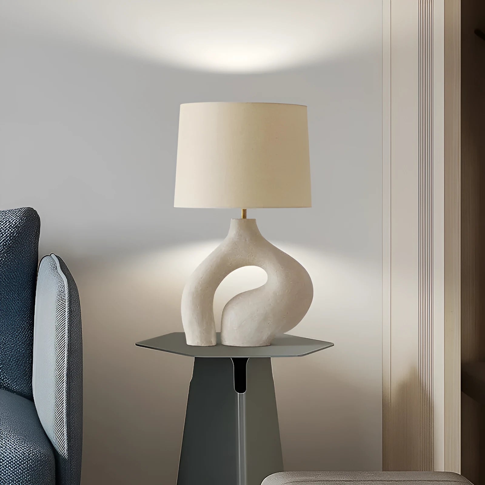 Modern minimalist table lamp with Nordic fabric shade on a bedside table