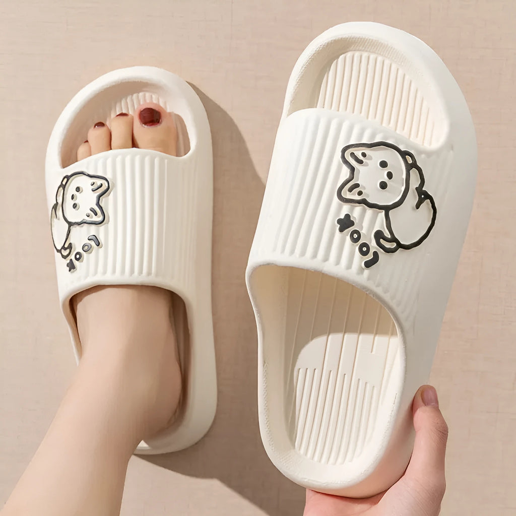 Women's green cat slippers with thick platform sole and flip-flop design on a white background.