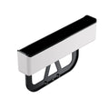 Black plastic car seat gap storage box organiser shown between vehicle front seats.