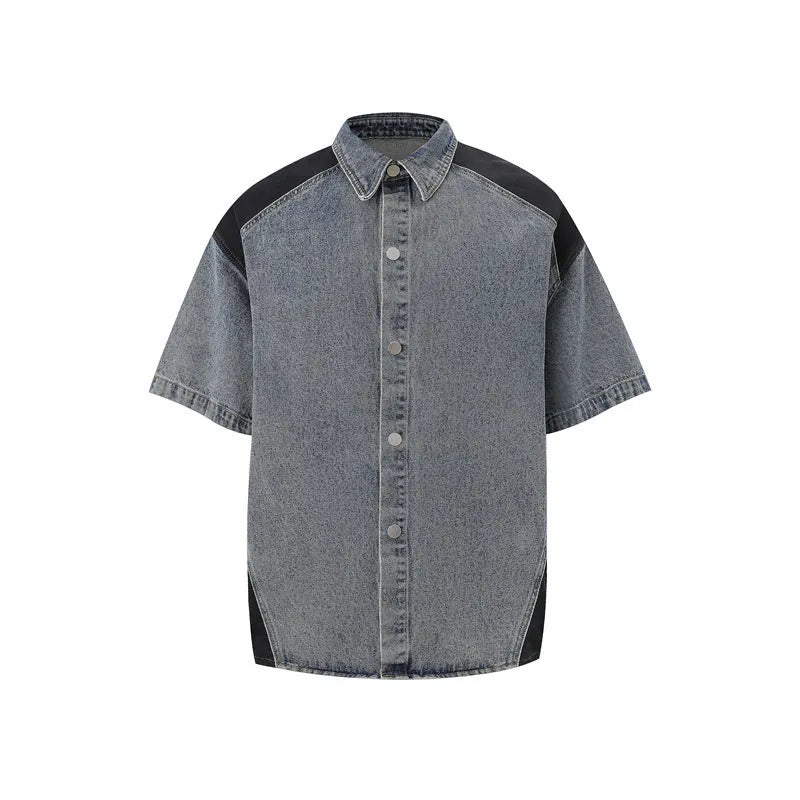 Retro washed blue denim suit set featuring a short-sleeved jacket and matching trousers on a rack.