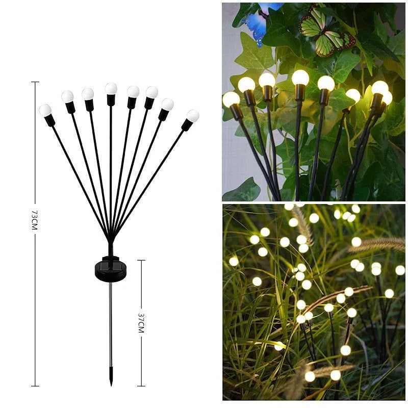 Solar powered LED ground spike garden light with multiple warm white and colour LED heads on stainless steel stake.