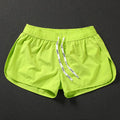 Men's loose fit beach shorts in polyester with elastic waistband for surfing and swimming