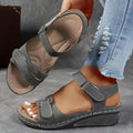 Women's beige strap sandals with a thick composite sole and adjustable Velcro fastening.