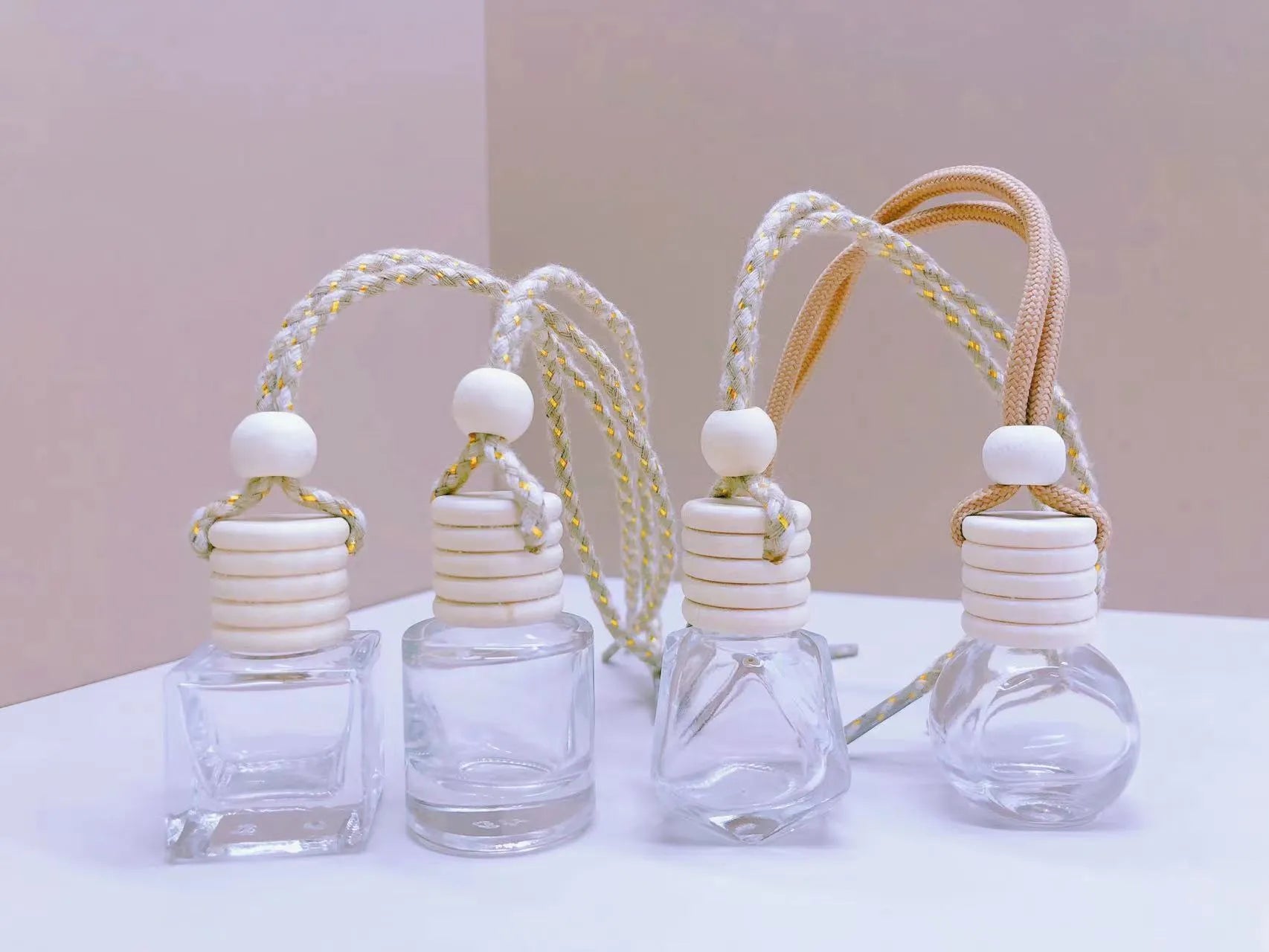 Car perfume pendant in glass with four style options for vehicle air freshening