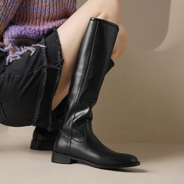 Women's black cowhide leather knee-high riding boots with chunky heel, round toe, and side zipper