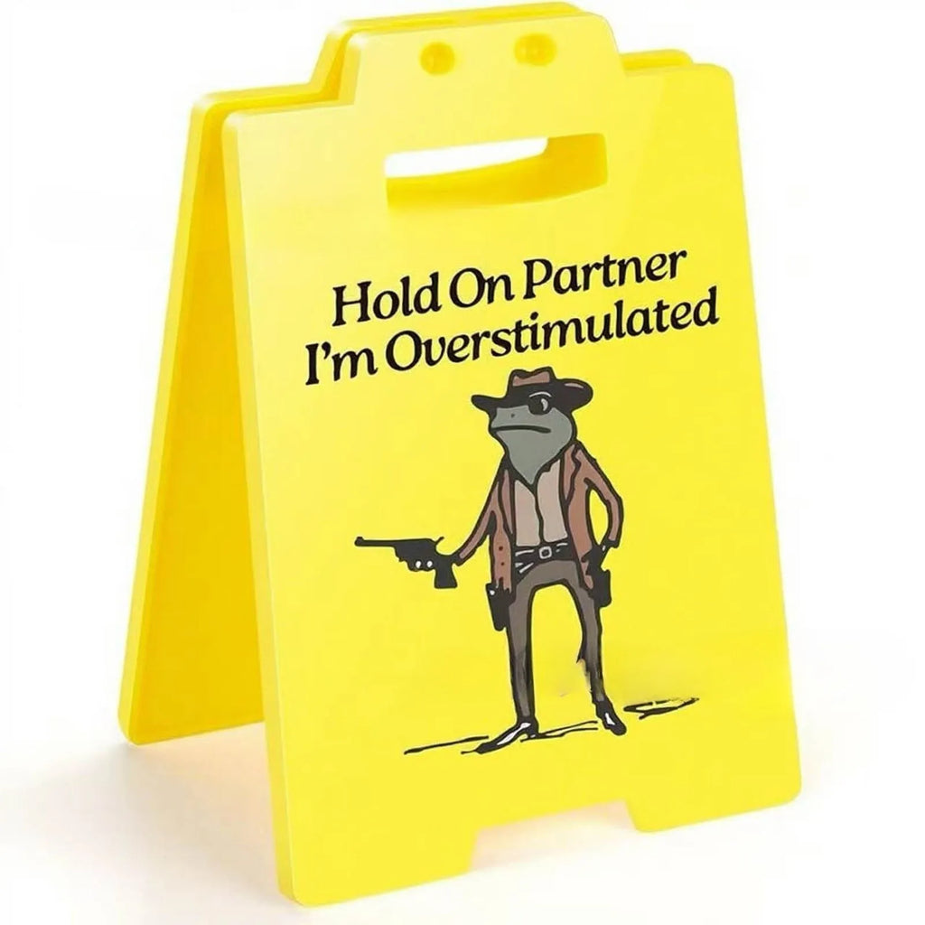 Yellow plastic humour desk decoration with simple modern design on a shelf