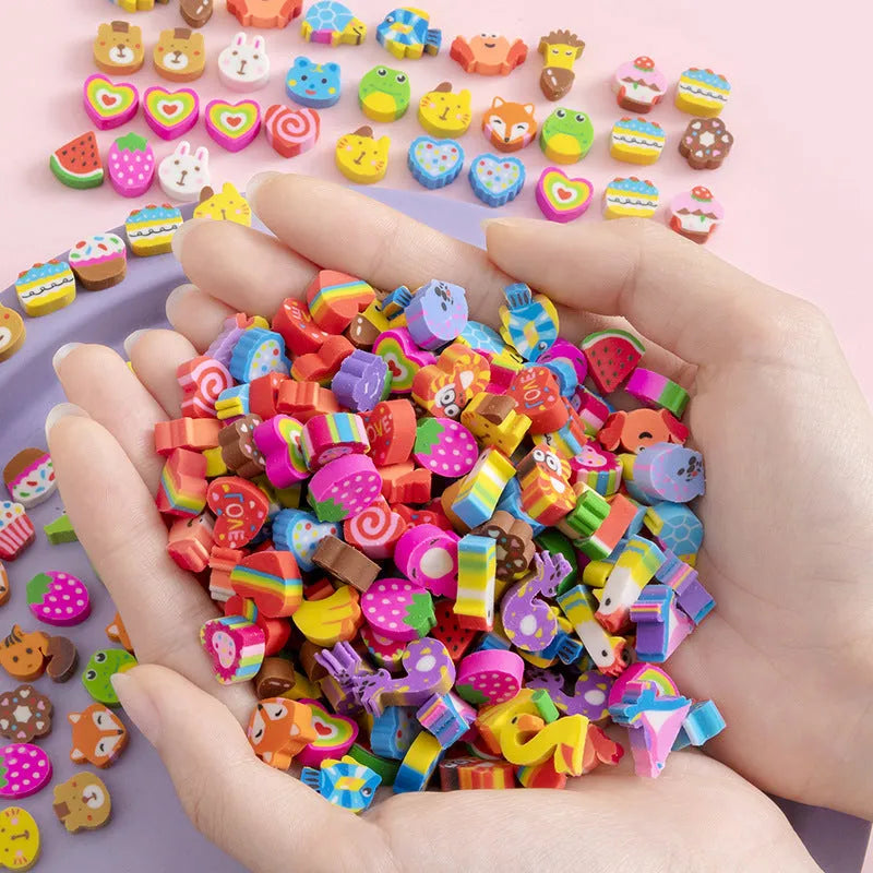 Assortment of 50 small colourful cartoon erasers showing fruit, animal, and aerospace designs.