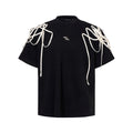 Black loose fit women's T-shirt with rivet ribbon padded shoulder detail and short sleeves
