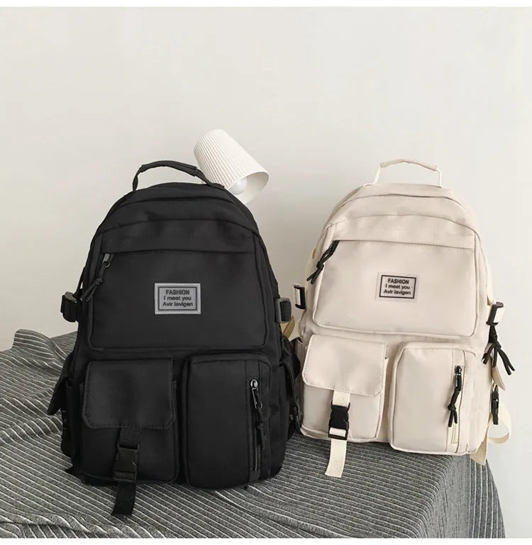 Soft nylon student backpack in black colour with computer compartment and three-dimensional pockets