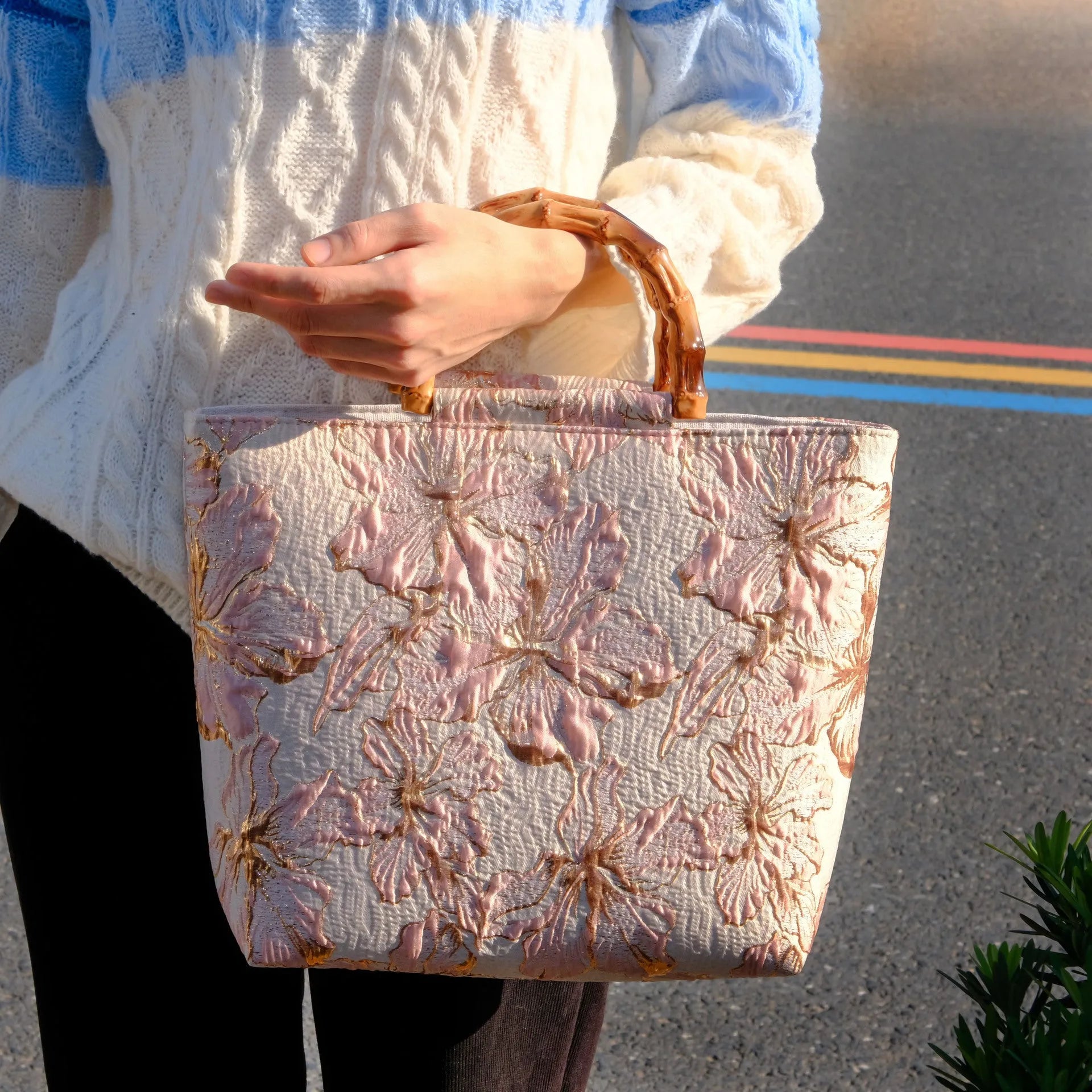 Light blue square canvas shoulder bag with bronzing flower detail and double strap connectors