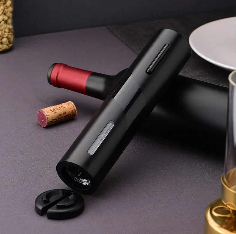 New Base five-in-one electric bottle opener set with black ABS decanter, vacuum stopper, foil knife, and storage base