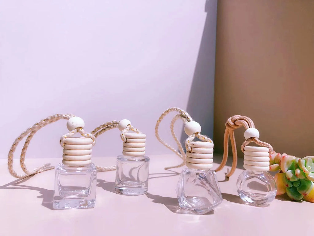 Car perfume pendant in glass with four style options for vehicle air freshening