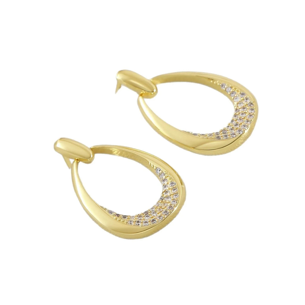 Women's yellow gold geometric drop earrings with ring and oval elements measuring 2.6 by 1.7 cm