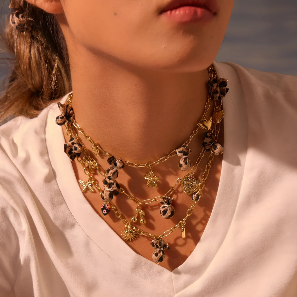 Geometric leopard pendant necklace with love heart and flower engravings on gold-plated chain