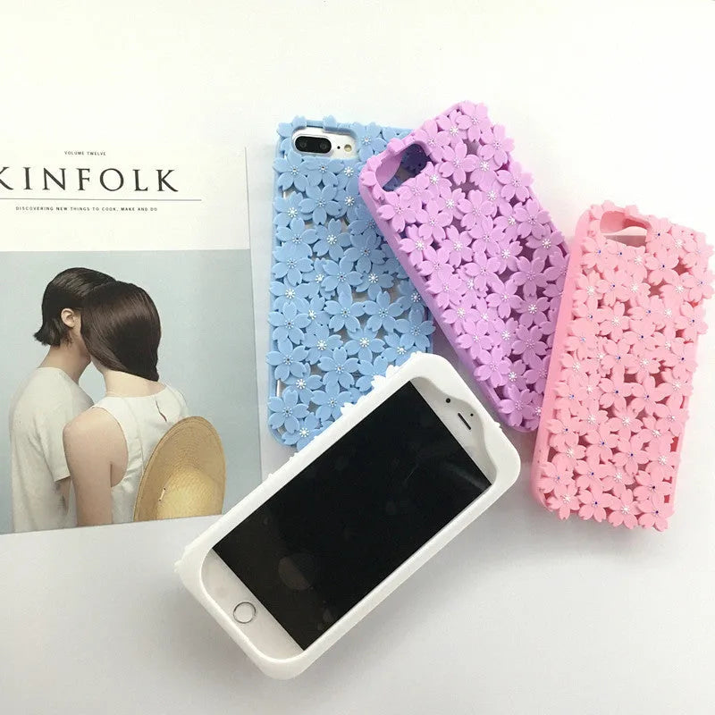 Blue silicone phone case with three-dimensional hollow flower openwork design for iPhone models
