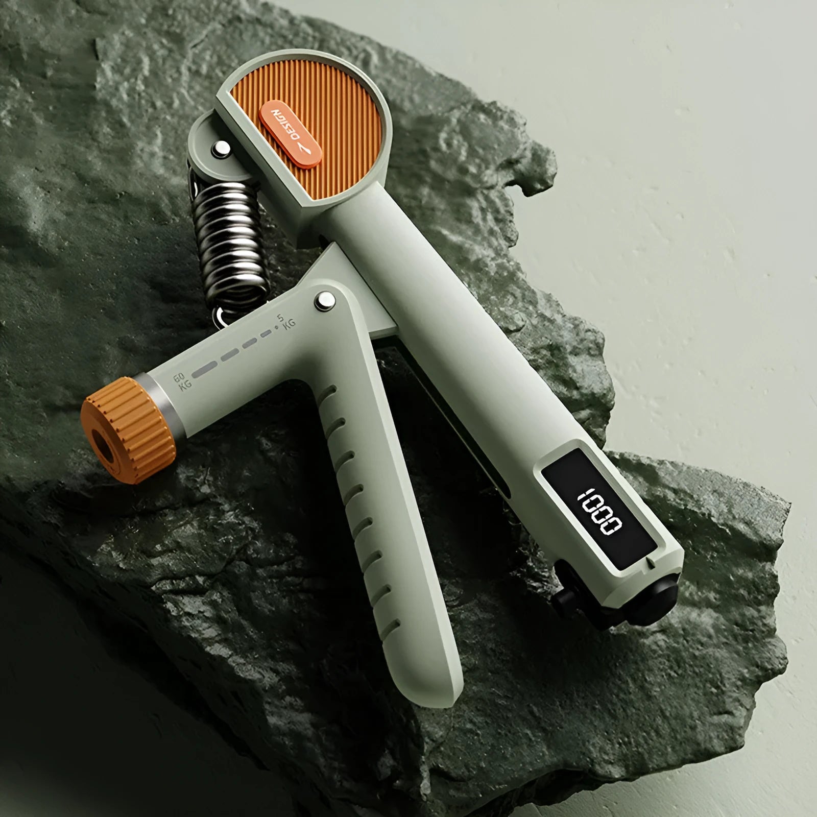 Adjustable spring hand grip strengthener in ABS plastic for home fitness and massage.