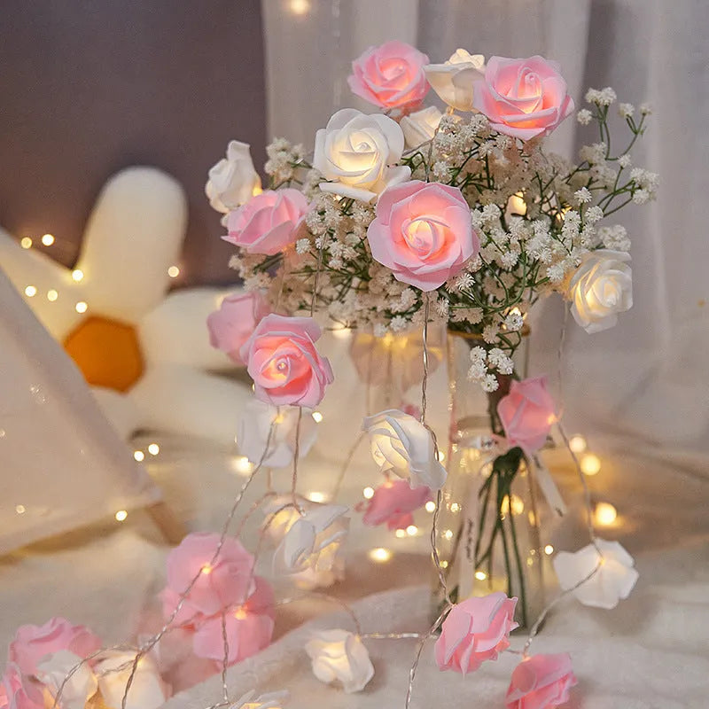 LED rose-shaped fairy light string with PV foam lamps on a 1.5m battery-powered cord for indoor holiday decoration.
