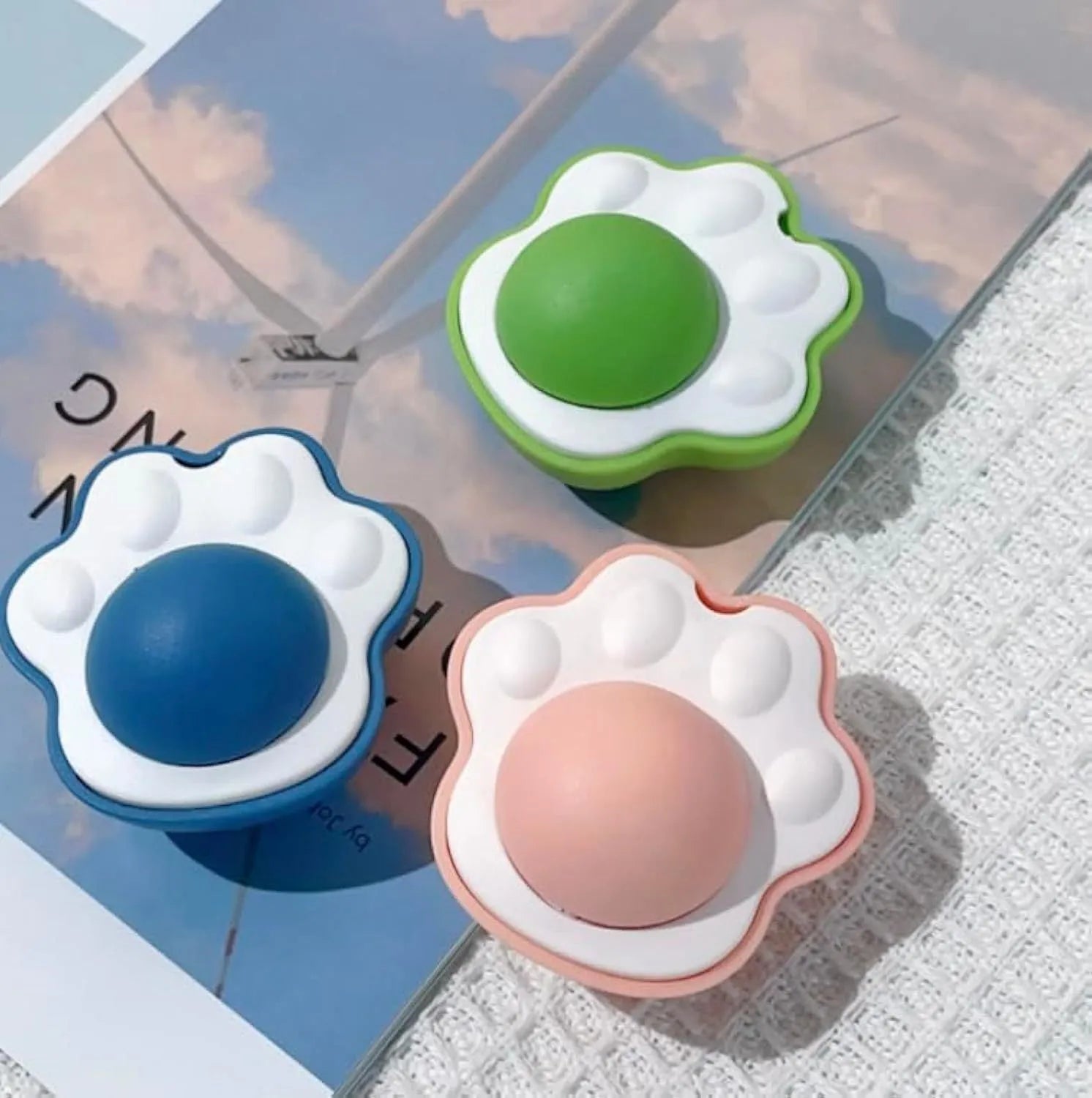 Blue, green, and pink edible vine catnip balls for dental chewing and play