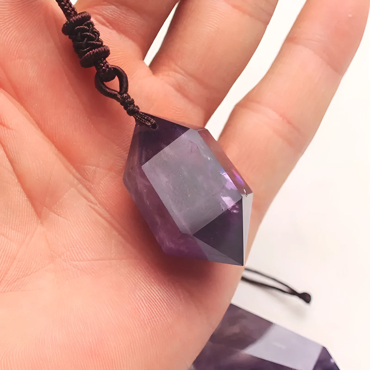 Natural amethyst hexagonal pendant in purple with geometric Korean style, shown as a crystal jewellery piece.