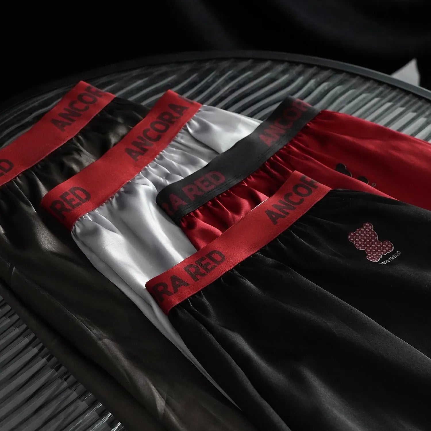 Men's solid colour polyester boxer briefs on a white background, showing the mid-waist design.