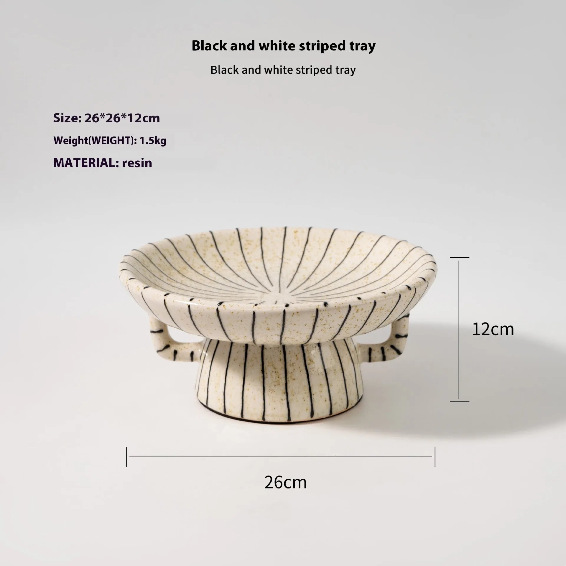 Black and white striped synthetic resin fruit plate on table