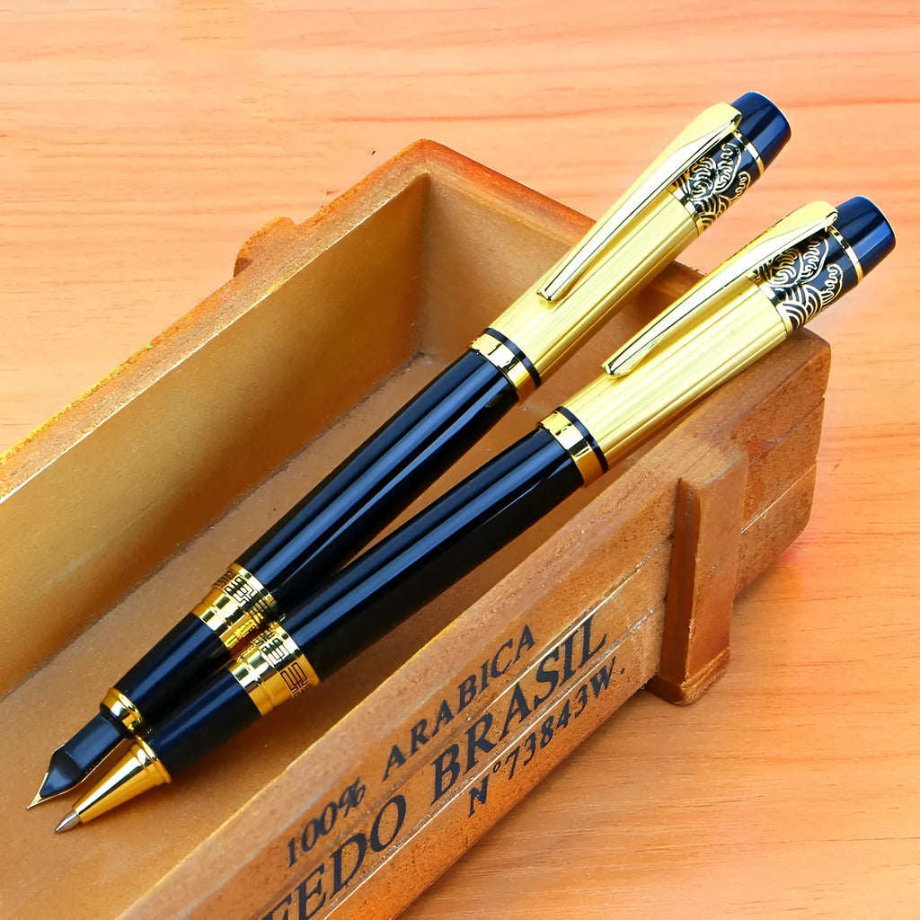 Black metal fountain pen with iridium nib and patterned orb design, shown on a desk