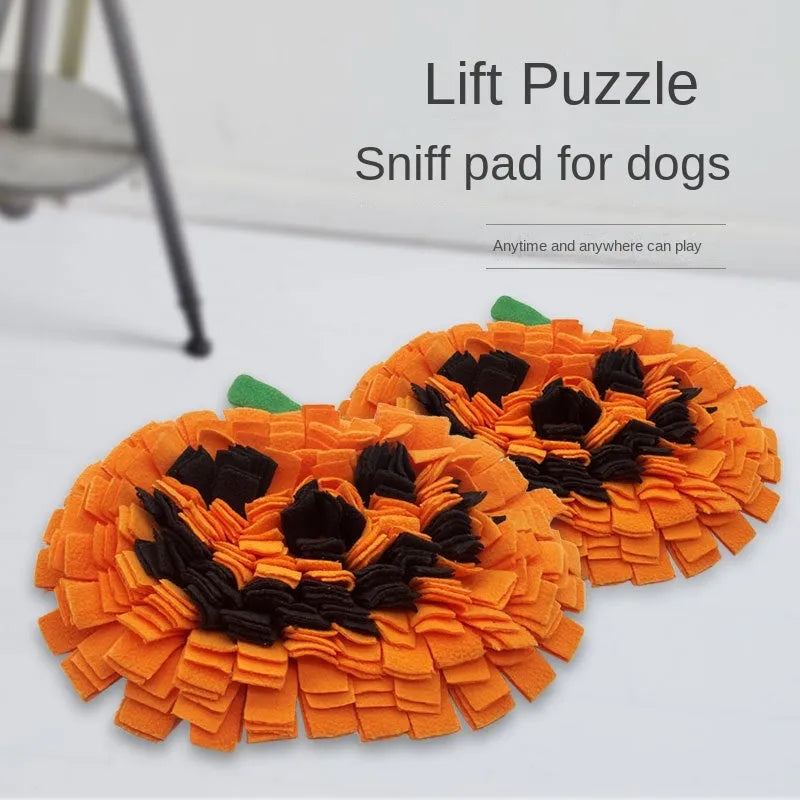 Orange pumpkin-shaped dog sniffing mat with a textured fur surface for slow feeding.