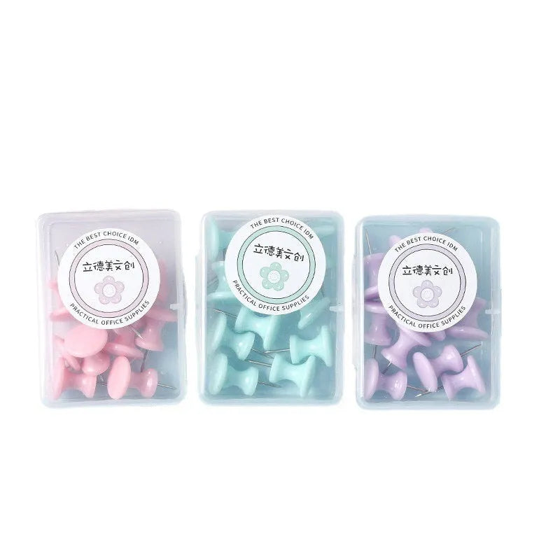 Plastic push pins in cherry blossom pink, mint green, and lavender colours, shown in large and small sizes, packaged in a box.