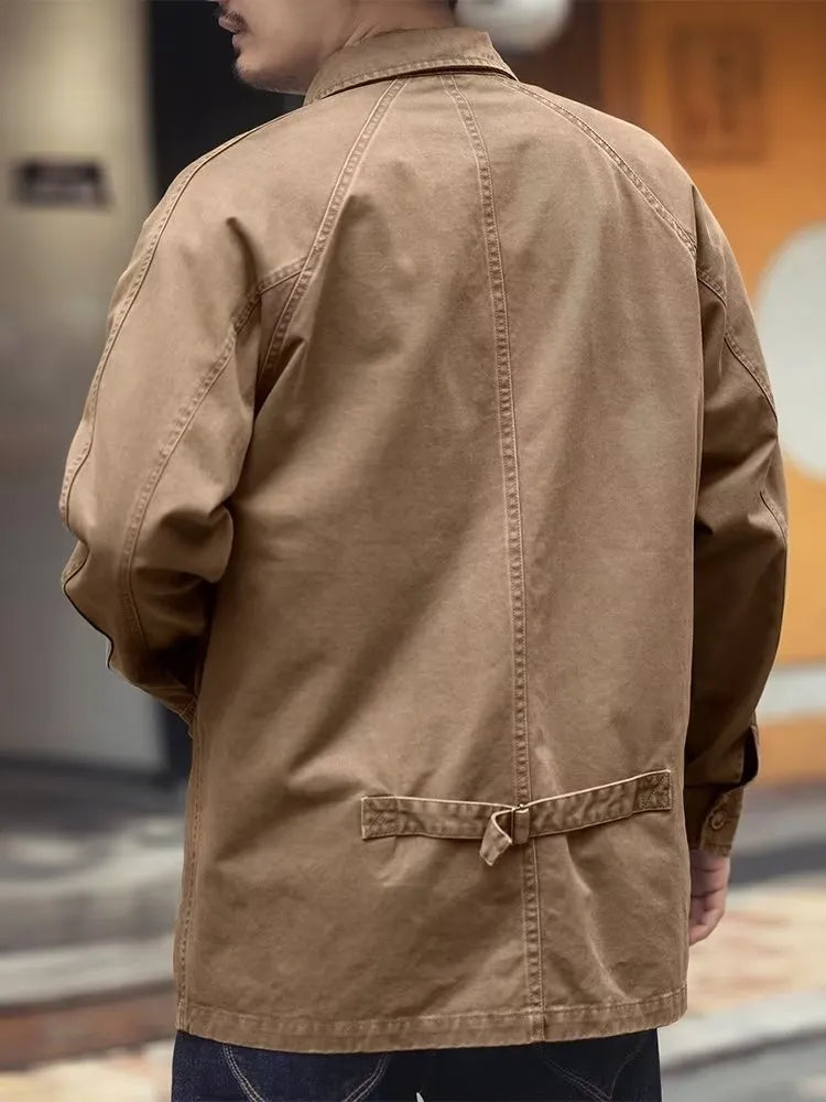Men's khaki cotton blend denim jacket with loose fit and multiple pockets on a plain background