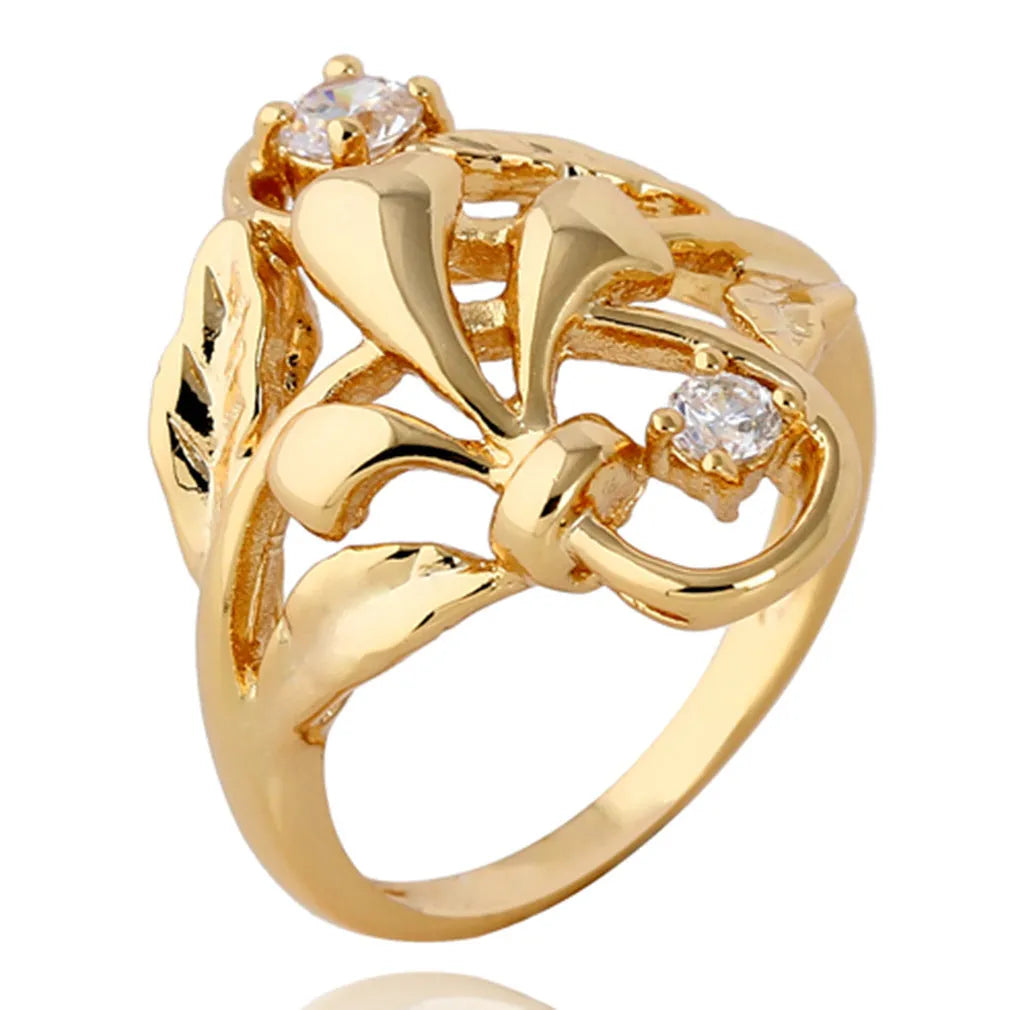 Gold tone copper ring with irregular leaf shape and white zircon crystal on geometric band, women's fashion jewellery