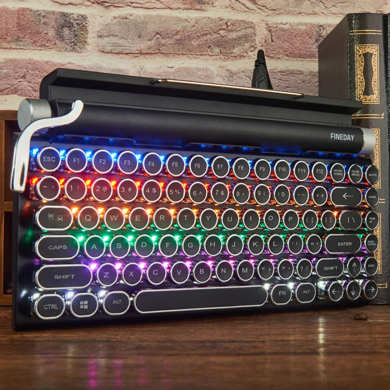 Black dot retro typewriter style Bluetooth mechanical keyboard on a desk.