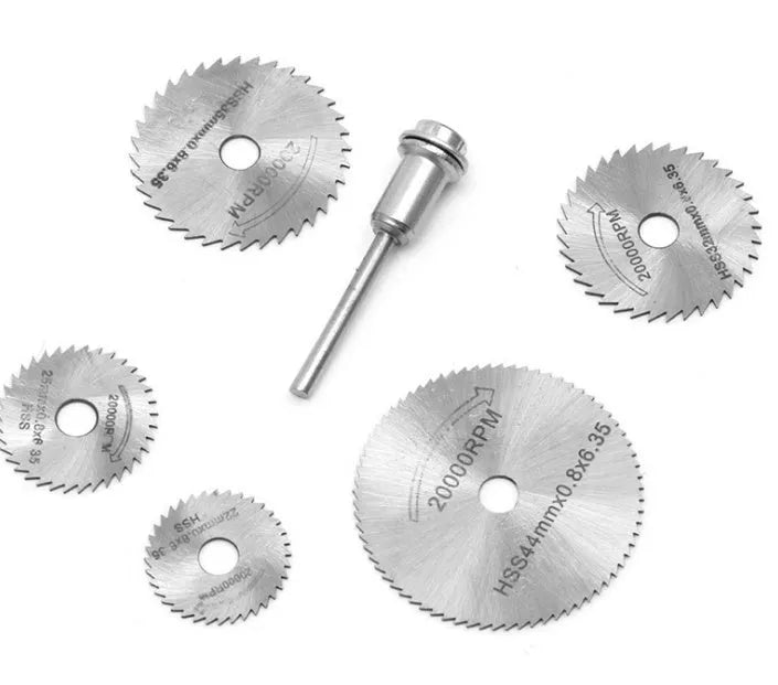 Six circular saw blades with mandrels for woodworking cutting, showing high-speed steel construction