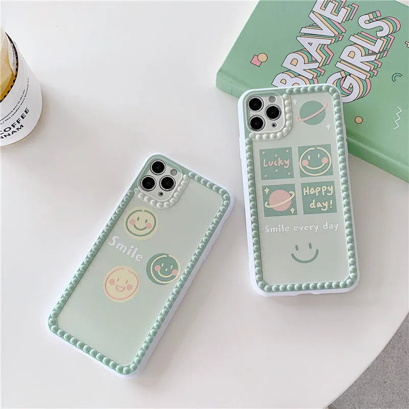 Green TPU iPhone case with geometric shapes and smiley faces inside a polka dot frame.